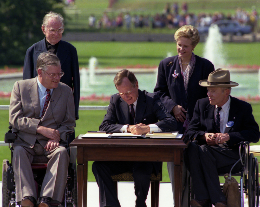 President Bush signs the Americans with Disabilities Act on the South Lawn of the White House